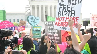 Pro-life and pro-abortion activists at a demonstration outside the U.S. Supreme Court as it hears arguments in the Moyle v. United States case, in Washington, D.C., on April 24, 2024. The case deals with whether an Idaho abortion law conflicts with the federal Emergency Medical Treatment and Labor Act (EMTALA).