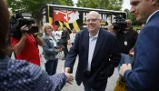 Larry Hogan, Republican candidate for U.S. Senate in Maryland, greets supporters before casting his ballot in the state primary election at Davidsonville Elementary School on May 14, 2024, in Davidsonville, Maryland.