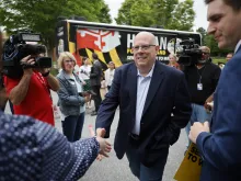 Larry Hogan, Republican candidate for U.S. Senate in Maryland, greets supporters before casting his ballot in the state primary election at Davidsonville Elementary School on May 14, 2024, in Davidsonville, Maryland.