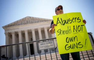 Christian Defense Coalition Director Rev. Patrick Mahoney holds a sign that reads "Abusers Should NOT Own Guns!" outside the Supreme Court on June 21, 2024, in Washington, D.C. Credit: Andrew Harnik/Getty Images