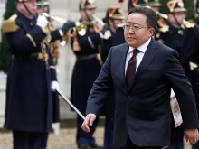 Mongolian President Tsakhiagiin Elbegdorj walks past Republican Guards as he arrives before his meeting with French President Francois Hollande at the Elysee Palace on Nov. 19, 2015, in Paris.