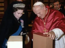 Queen Elizabeth ll exchanges gifts with Pope John Paul ll during her first visit to the Vatican on Oct. 17, 1980.