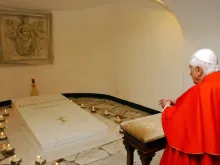 Pope Benedict XVI visits the tomb of the late Pope John Paul II in the grotto beneath St. Peter's Basilica after a meeting with young Catholics, in preparation of the XXI World Youth Day at the Vatican April 6, 2006.