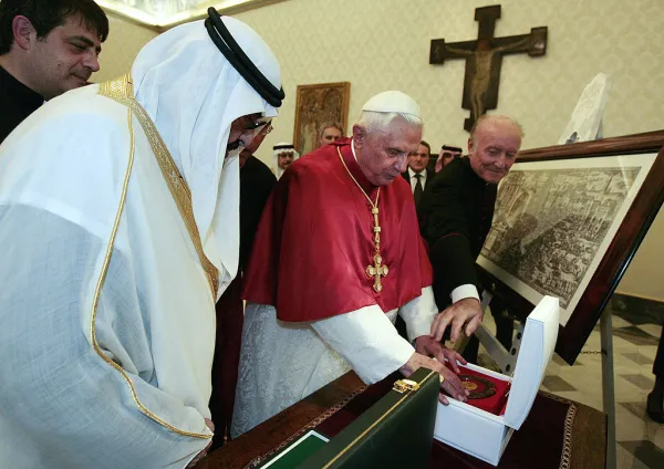 Pope Benedict XVI exchanges gifts with Saudi Arabia's King Abdullah (left) at the Vatican on Nov. 6, 2007. POOL/AFP via Getty Images
