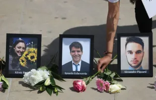 Flowers are placed alongside a photograph of Ignacio Echeverría and others killed in the London Bridge terror attack prior to a commemoration service on June 3, 2018, the first anniversary of the attack that killed eight people and injured dozens more. Photo by DANIEL LEAL/AFP via Getty Images