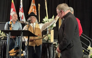 Vancouver Archbishop J. Michael Miller is presented with a gift at the Sacred Covenant signing on Sunday, March 31, 2024. Credit: Archdiocese of Vancouver