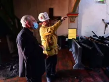 Archbishop Jose Gomez of Los Angeles visits the scene of the fire at Mission San Gabriel church, July 11, 2020.