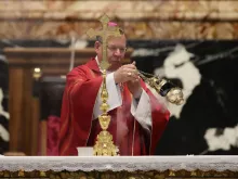Archbishop Gintaras Grušas of Vilnius offers Mass on the feast of St. Luke for the Synod on Synodality delegates in St. Peter's Basilica on Oct. 18, 2023.