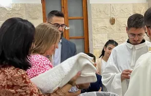 Hussam Abu Sini and Chiara Pezzulich bring their daughter, Marta, to be baptized on Thursday, Oct. 19, 2023, in St. John the Baptist Catholic Church in Haifa, Israel. Credit: Photo courtesy of Hussam Abu Sini