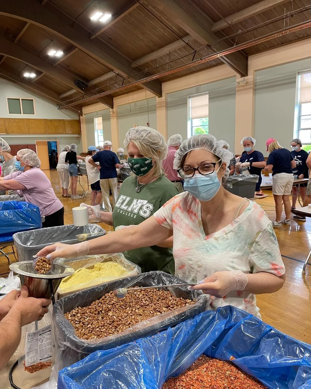 Volunteers pack meals for families in Haiti at St. Cecilia parish in Wilbraham, Mass., May 2022.?w=200&h=150