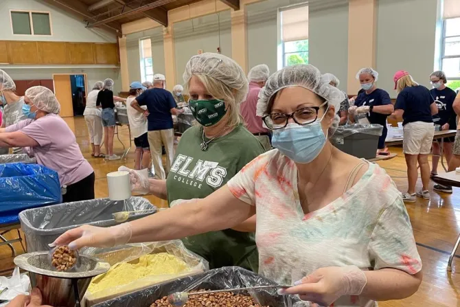 Volunteers pack meals for families in Haiti at St. Cecilia parish in Wilbraham, Mass., May 2022.