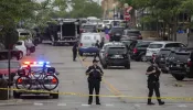 First responders take away victims from the scene of a mass shooting at a Fourth of July parade on July 4, 2022 in Highland Park, Illinois. At least six people were killed and 19 injured, according to published reports.