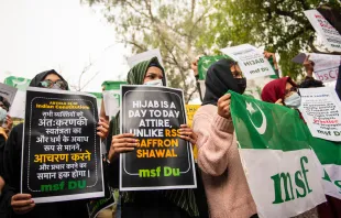 Members of All India Muslim Students Federation protest against the hijab ban in educational institutions by the Karnataka government at Delhi University in New Delhi, India, Feb. 9, 2022. PradeepGaurs/Shutterstock.