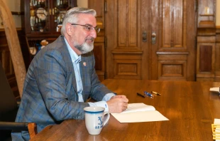 Indiana Governor Eric Holcomb signs bills in Indianapolis, March 10, 2022. Governor Eric Holcomb via Flickr (public domain)
