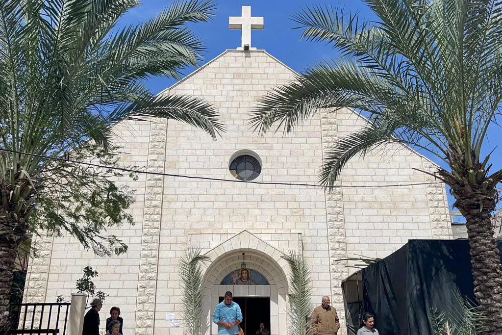 People gather at the Roman Catholic Church of the Holy Family on Palm Sunday in al-Zaitoun neighborhood of Gaza City on March 24, 2024, amid the ongoing conflict between Israel and the Palestinian Hamas movement.?w=200&h=150