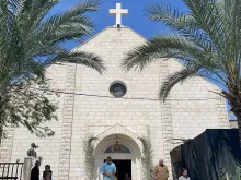 People gather at the Roman Catholic Church of the Holy Family on Palm Sunday in al-Zaitoun neighborhood of Gaza City on March 24, 2024, amid the ongoing conflict between Israel and the Palestinian Hamas movement.