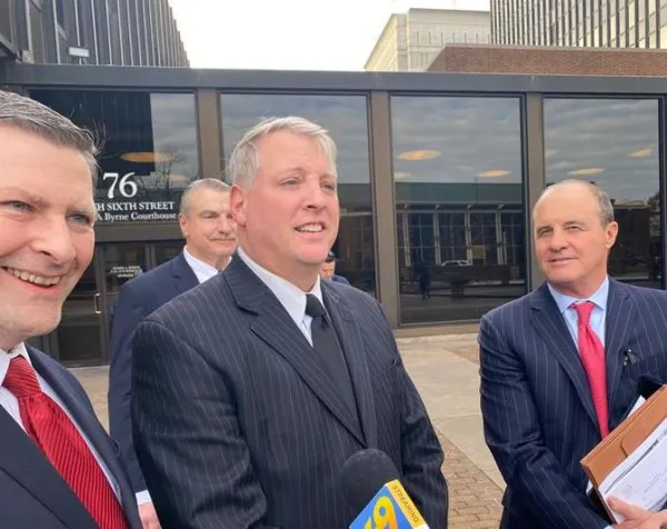 Mark Houck talks to reporters outside the U.S. District courthouse in Philadelphia with his lawyers, Peter Breen (left), Brian McMonagle (right), and Andrew Bath (background) following his acquittal on two charges of violating the FACE Act, Jan. 30, 2023. Credit: Joe Bukuras/CNA