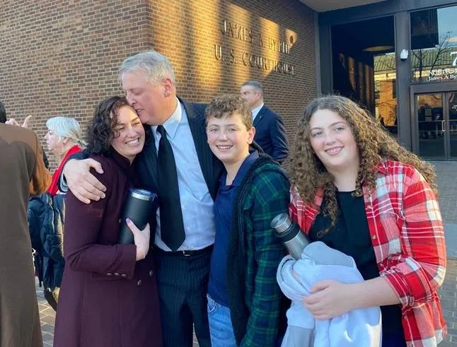 After being acquitted of federal charges by a jury in Philadelphia on Monday, Jan. 30, 2023, Mark Houck embraces and kisses his wife, Ryan-Marie Houck. Also with Houck are his son Mark Houck Jr., 14, and his daughter, Ava Houck, 12.?w=200&h=150