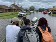 Louisiana National Guardsmen rescue people in LaPlace, Louisiana, in the aftermath of Hurricane Ida. More than 6,000 members of the National Guard from more than a dozen states were in Louisiana assisting state and federal partners with relief efforts.