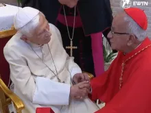 Pope Emeritus Benedict XVI greets Colombian Cardinal Jorge Enrique Jiménez Carvajal at the retired pope's Vatican residence on Aug. 27, 2022.