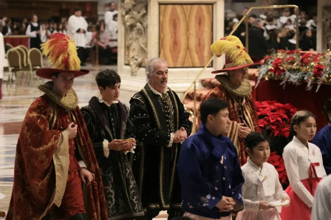 Families representing nations around the world brought up the gifts at the Epiphany Mass.