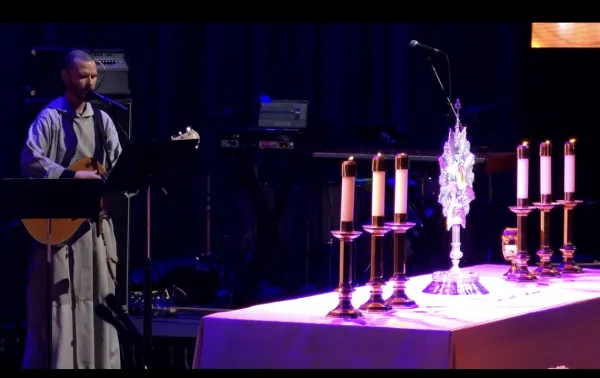 Singer and guitarist Father Isaiah Hofman of the Franciscan Friars of the Renewal peforms at the Eucharistic Adoration proceeding the celebration of the Mass at Life Fest. Screenshot from live stream of Life Fest