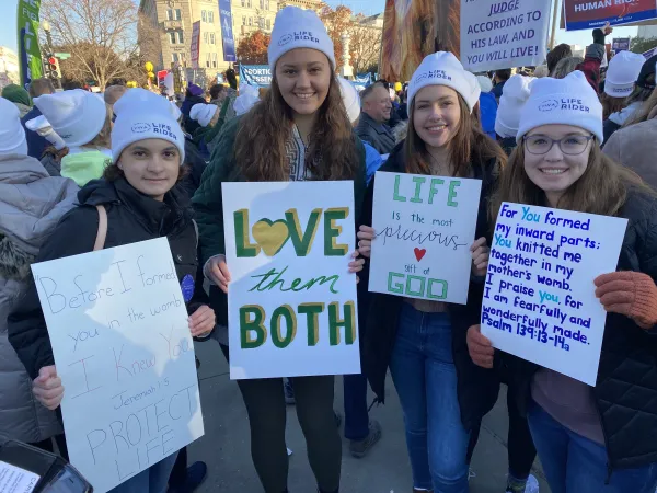 From left to right: Amaya Kocher from Cecil, Pennsylvania, Mathilde Steenepoorte from Green Bay, Wisconsin, Megan Moyer from Sunbury, Pennsylvania, and Ellie Kaynor from Detroit, Michigan, woke up around 5:45am to attend the pro-life rally together outside the U.S. Supreme Court on Dec. 1, 2021. Katie Yoder/CNA