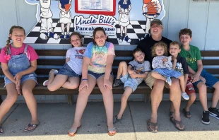 Mark Houck with his children Credit: Thomas More Society