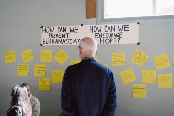 On Sept. 23, 2023, Amanda Achtman organized a daylong open-house-style event called “The Church as an Expert in Humanity” in Calgary, Alberta. Participants added ideas for how we, the Church, can prevent euthanasia and encourage hope. Credit: Edward Chan/Community Productions