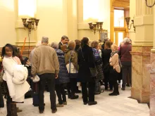 Members of the public wait to enter a hearing on an abortion bill at the Colorado capitol in Denver, March 9, 2022.