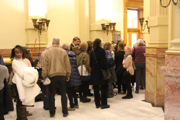 Members of the public wait to enter a hearing on an abortion bill at the Colorado state capitol on March 9, 2022.