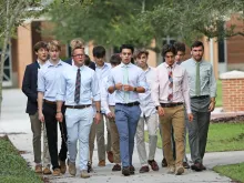 Jimmy Mitchell (front row, far left) leads a group of Jesuit High School students in Tampa, Florida, in a walking rosary after school.