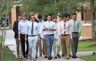 Jimmy Mitchell (front row, far left) leads a group of Jesuit High School students in Tampa, Florida, in a walking rosary after school. Credit: Jesuit High School