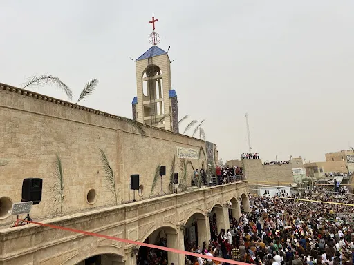 Palm Sunday crowds gather outside the restored Church of St. Mary at Al-Tahira, in Qaraqosh, the largest Catholic church in Iraq, on April 10, 2022. Bashar Yameel Hanna/CNA