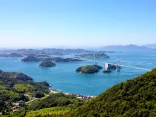 The Seto Inland Sea is the body of water separating Honshū, Shikoku, and Kyūshū, three of the four main islands of Japan.