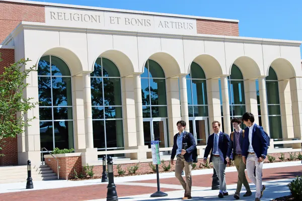 Jesuit High School students walking in front of the new Antinori Center for the Arts on campus. Credit: Jesuit High School
