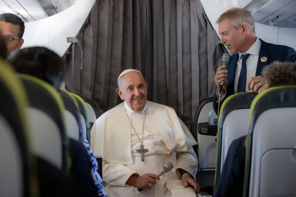 Pope Francis listens to questions from journalists aboard the papal flight to Rome on Aug. 6, 2023, following his visit to Portugal and World Youth Day in Lisbon. Daniel Ibáñez/CNA