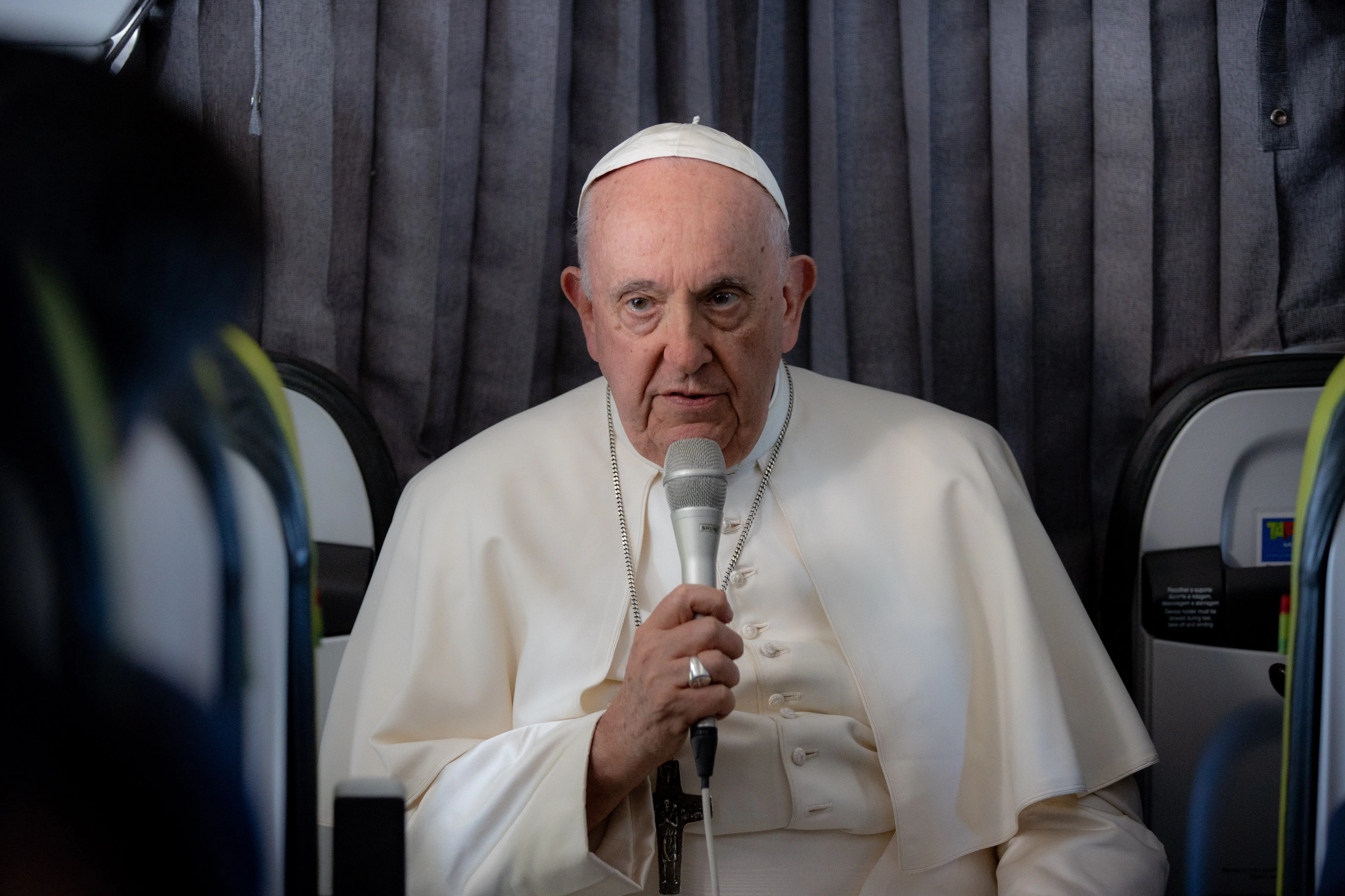 Pope Francis addresses reporters on Aug. 6, 2023 aboard the papal flight on his return to Rome from his five-day trip to Portugal and World Youth Day.?w=200&h=150