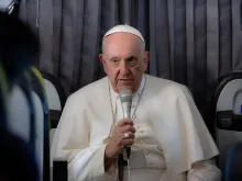 Pope Francis addresses reporters on Aug. 6, 2023 aboard the papal flight on his return to Rome from his five-day trip to Portugal and World Youth Day.