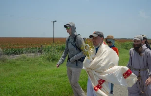 Charlie McCullough, in grey hoodie, walks with the Eucharistic procession through southern Texas. Credit: Issy Martin-Dye