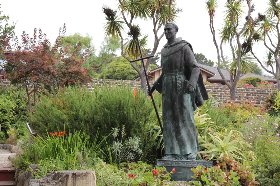 Photograph of a bronze statue of Saint Father Junipero Serra in the Gardens of the Carmel Mission Basilica in Carmel, California?w=200&h=150