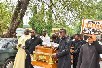 Priests protest at the funeral of Father Vitus Borogo in the archdiocese of Kaduna on June 30, 2022.