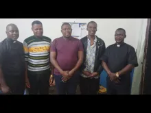 The three seminarians (C) who were released Oct. 13, 2021 by their captors, between Fr. Emmanuel Faweh Kazah, rector of the St Albert Institute, and Fr Jonah Yabanad Stephen, rector of Christ the King Major Seminary.