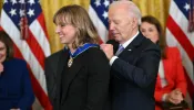 President Joe Biden presents the Presidential Medal of Freedom to U.S. swimmer Katie Ledecky in the East Room of the White House in Washington, D.C., on May 3, 2024.