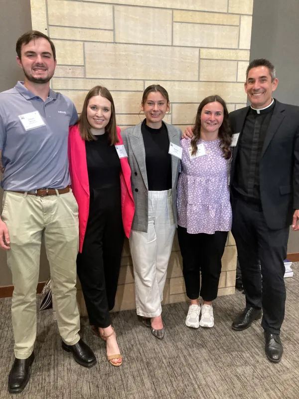 Kansas State University students, from left: junior Dillon McGinn, 20; junior Jenna Reinert, 21; senior Halley Jones, 21; Elizabeth Wright, 22, (a 2023 graduate who started a Catholic Rural Life chapter in 2021); and Father Gale Hammerschmidt, pastor and chaplain at St. Isidore’s on campus. Credit: Susan Klemond/CNA