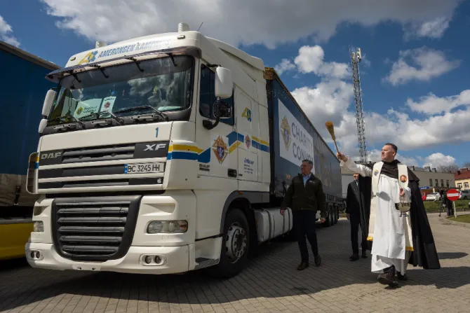 Father Jonathan Kalisch blesses a truck in Łancut, Poland, participating in a KofC Charity Convoy, April 12, 2022.