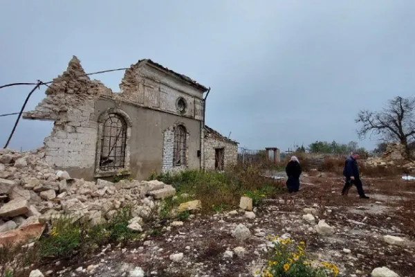 The nun and the priest visiting the destroyed church in Kyselivka, Ukraine. Benedictine Missionary Sisters