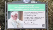 A group of Traditional Latin Mass supporters in Italy posted signs as part of a billboard campaign in a neighborhood near the Vatican on March 28, 2023.