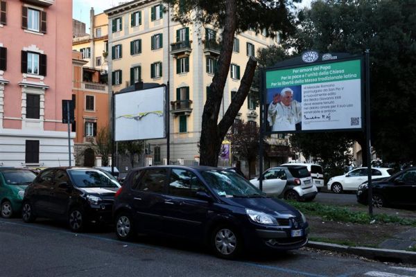 A group of Traditional Latin Mass supporters in Italy posted signs as part of a billboard campaign in a neighborhood near the Vatican on March 28, 2023. Credit: Daniel Ibañez/CNA
