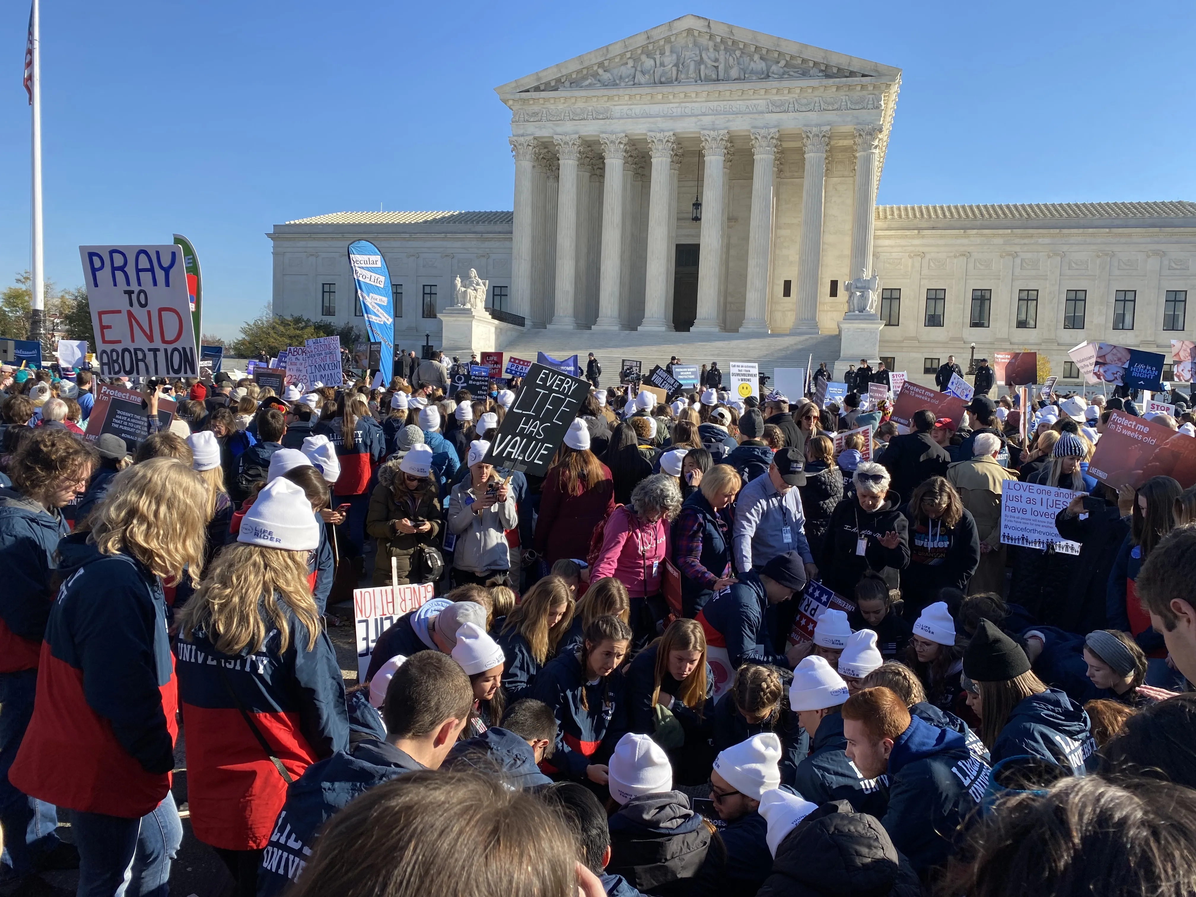 Students from Liberty University pray in front of the U.S. Supreme Court during oral arguments in the Dobbs v. Jackson Women's Health Organization abortion case on Dec. 1, 2021.?w=200&h=150